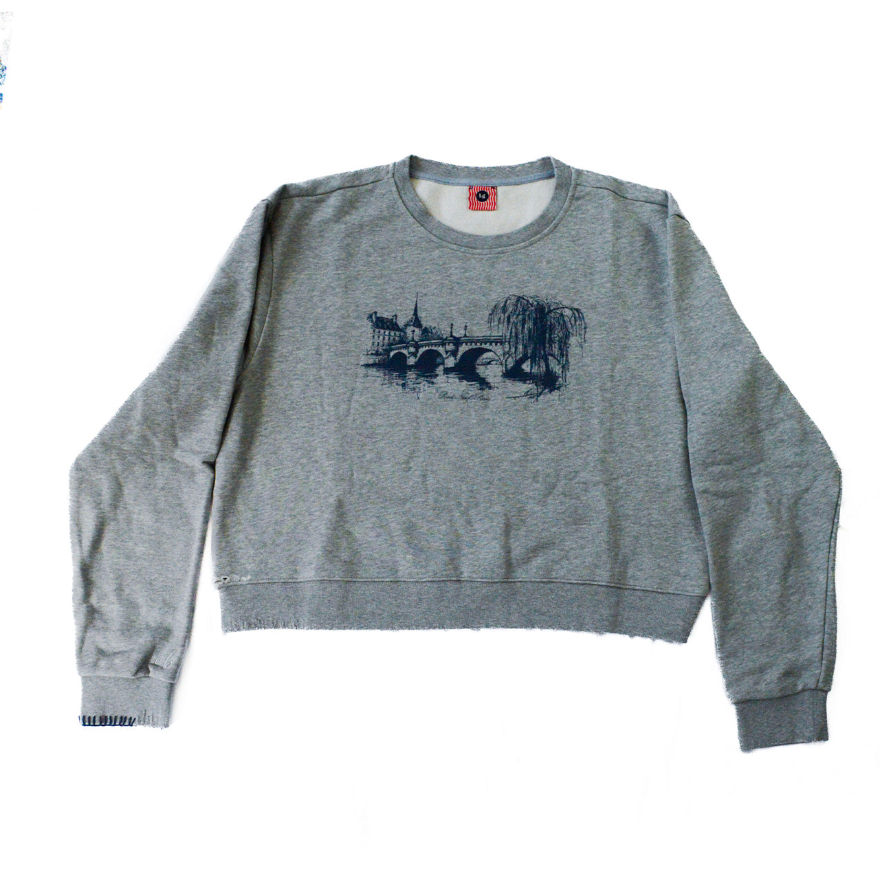 Gray sweatshirt with a paris graphic design on a white background